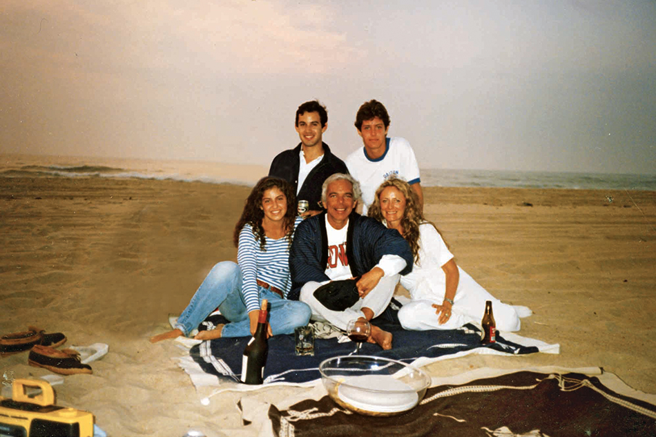 Lauren (center) and her family’s Hamptons history has taken them from a Southhampton rental (Ricky with Andrew, summer 1970, left) to a house on the Montauk beach (the entire clan, right, in 1989). All photos courtesy of Ricky Lauren