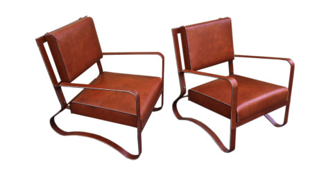 Pair of Jacques Adnet leather lounge chairs, 1940s, offered by Galerie Andre Hayat