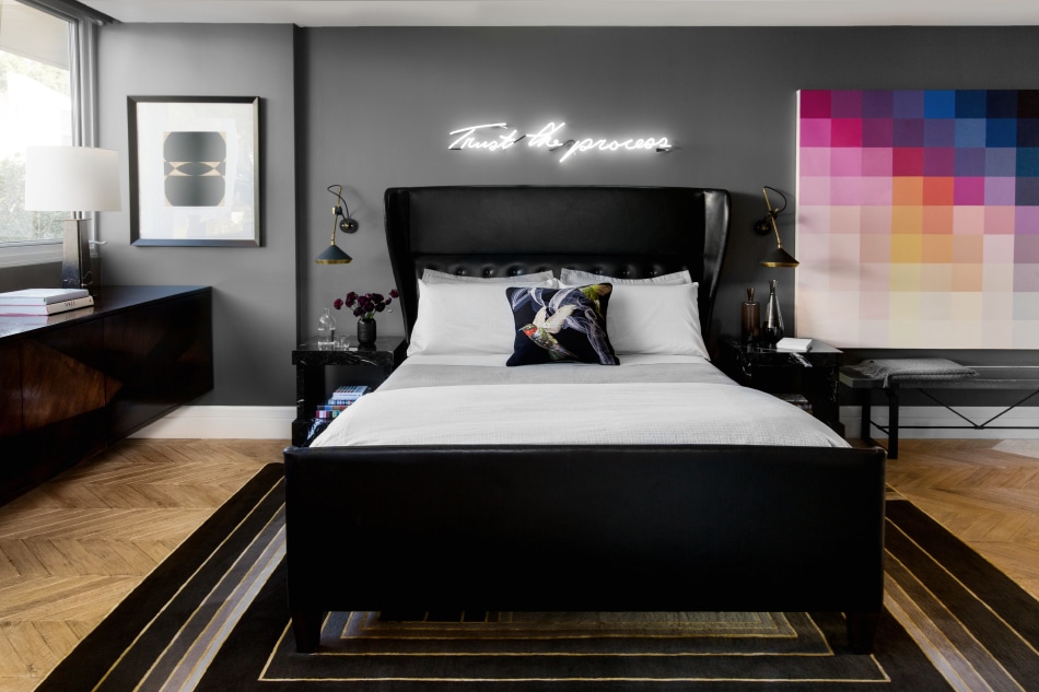 gray bedroom with neon sign
