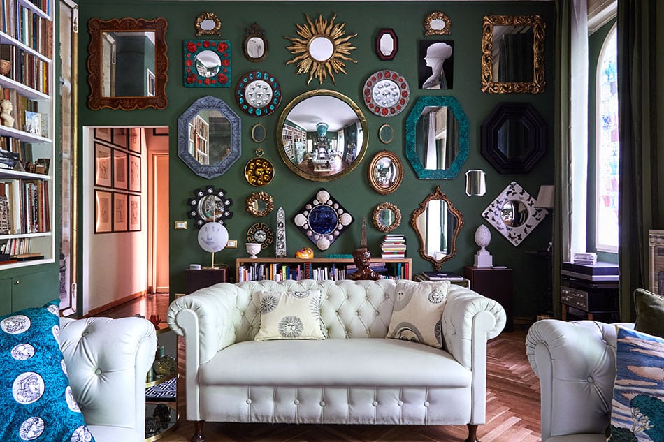 Barnaba Fornasetti's green living room with mirrors