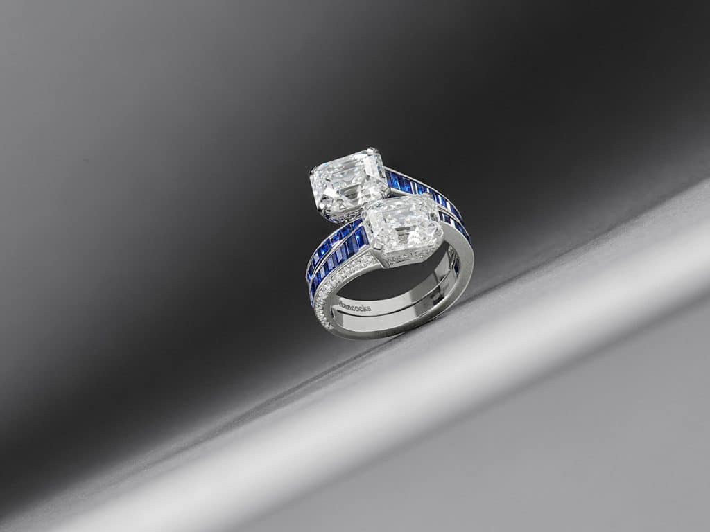 Hancocks Emerald-cut Diamond and Calibre Sapphire Cross Over Platinum Ring