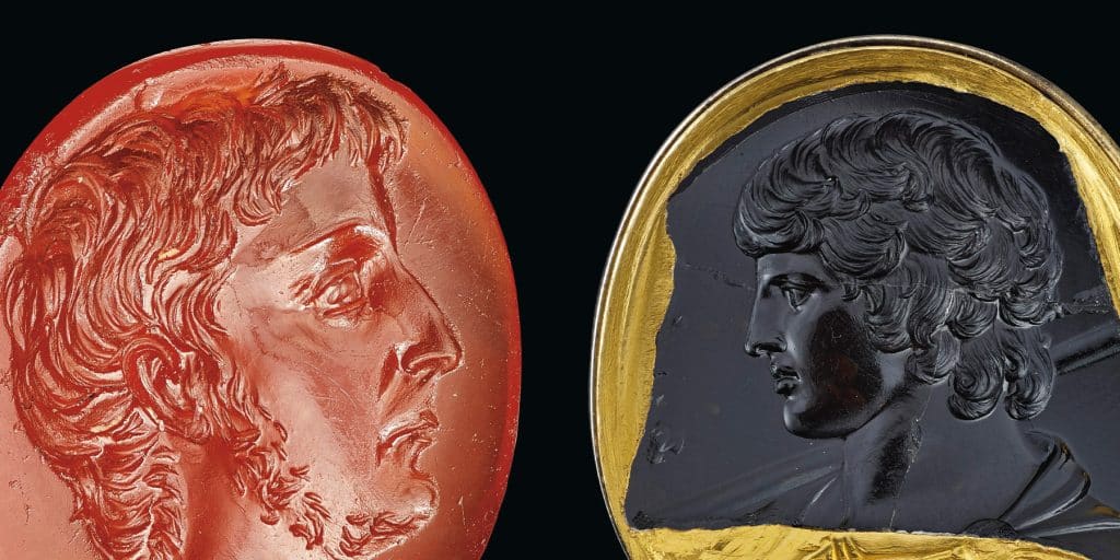 From left, a Roman carnelian ring stone with a portrait of Octivian, ca. mid-first century B.C. and Marlborough Antinous, a Roman black chalcedony intaglio portrait of Antinous, ca. 130-138 A.D.