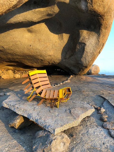 Sergio J. Matos's Arreio chair on a rocky beach