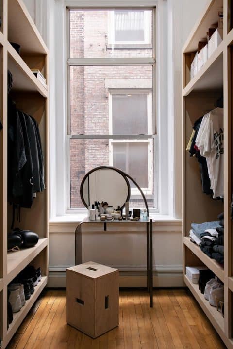 In the couple's closet is a Material Lust Retort vanity.