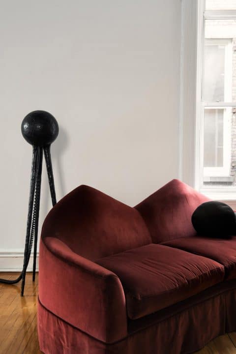 A special-edition Grotesque Crepuscle floor lamp (2017) and Twin Peak sofa (2016) are in the living room area.