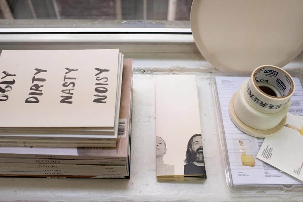 Adorning the windowsill are Material Lust brochures alongside other ephemera.