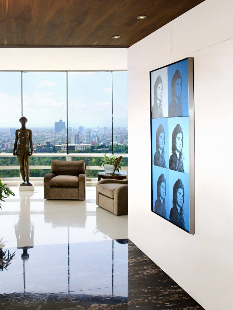 An art collector's Mexico City penthouse by Bradfield & Tobin features a Warhol Jackie painting.