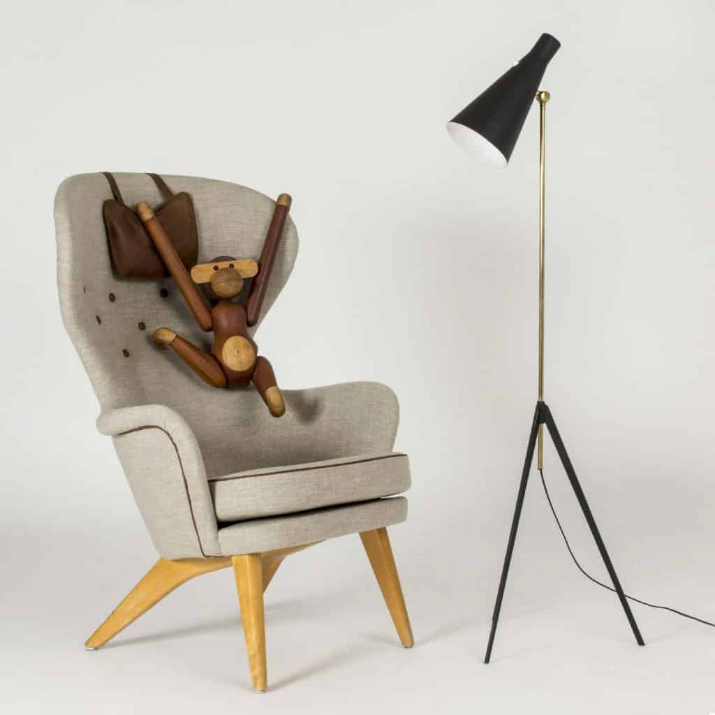 Kay Bojesen teak monkey toy, 1950s, on a chair