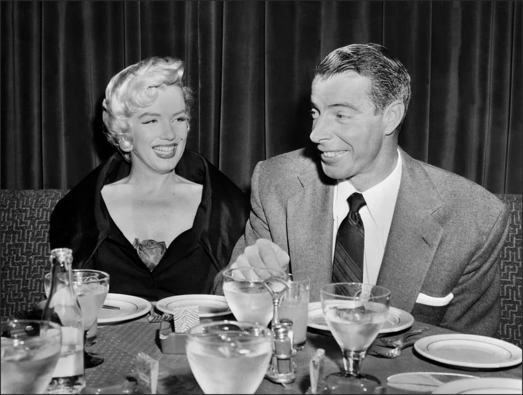 Screen legend Marilyn Monroe and baseball great Joe DiMaggio seated at a table in San Francisco in the 1950s