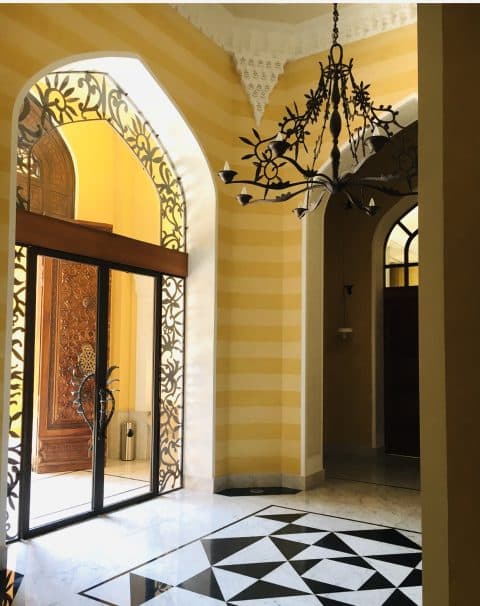 A bronze doorway and chandelier by Franck Evennou adorn the French ambassador's residence in Beirut