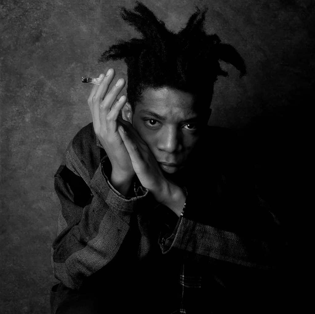 A black-and-white 1986 photo of Jean-Michel Basquiat