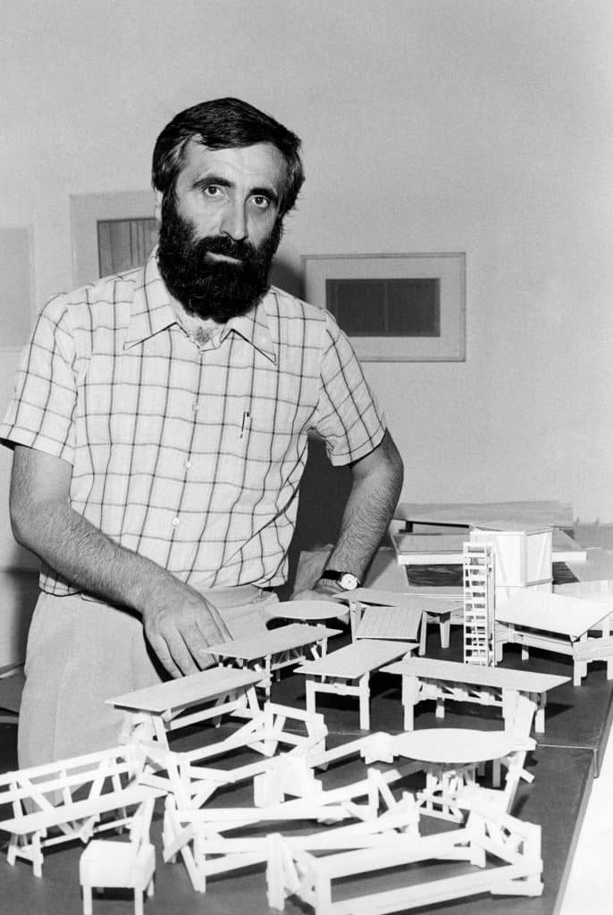 Enzo Mari with some of his furniture models in 1974