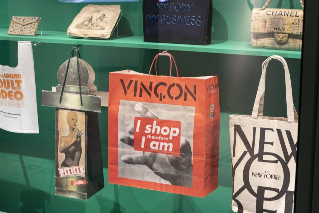 A display of bags with text and slogans in the exhibition “Bags: Inside Out,” at London's Victoria and Albert Museum