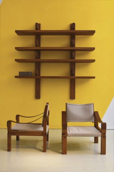 At Magen H Gallery's 2017 Pierre Chapo exhibition, a pair of circa-1960 wood and linen chairs sit beneath the B17 bookshelf