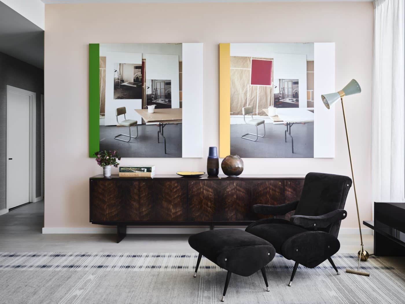 An Osvaldo Borsani armchair and ottoman and aJoaquim Tenreiro jacaranda sideboard in the living room of Gabriel & Guillaume's staged apartment at Fifteen Fifty in San Francisco