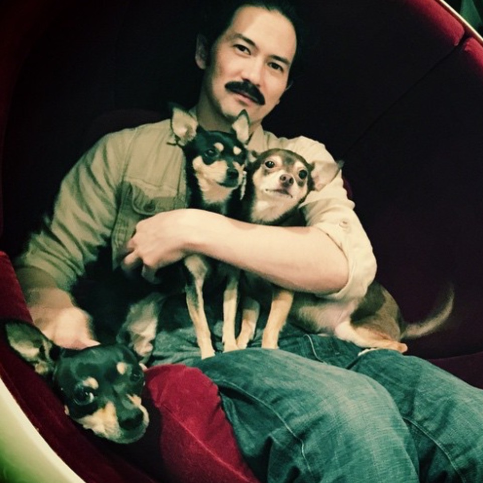Dexter Hamilton, owner of furniture gallery Automaton, poses with his dogs
