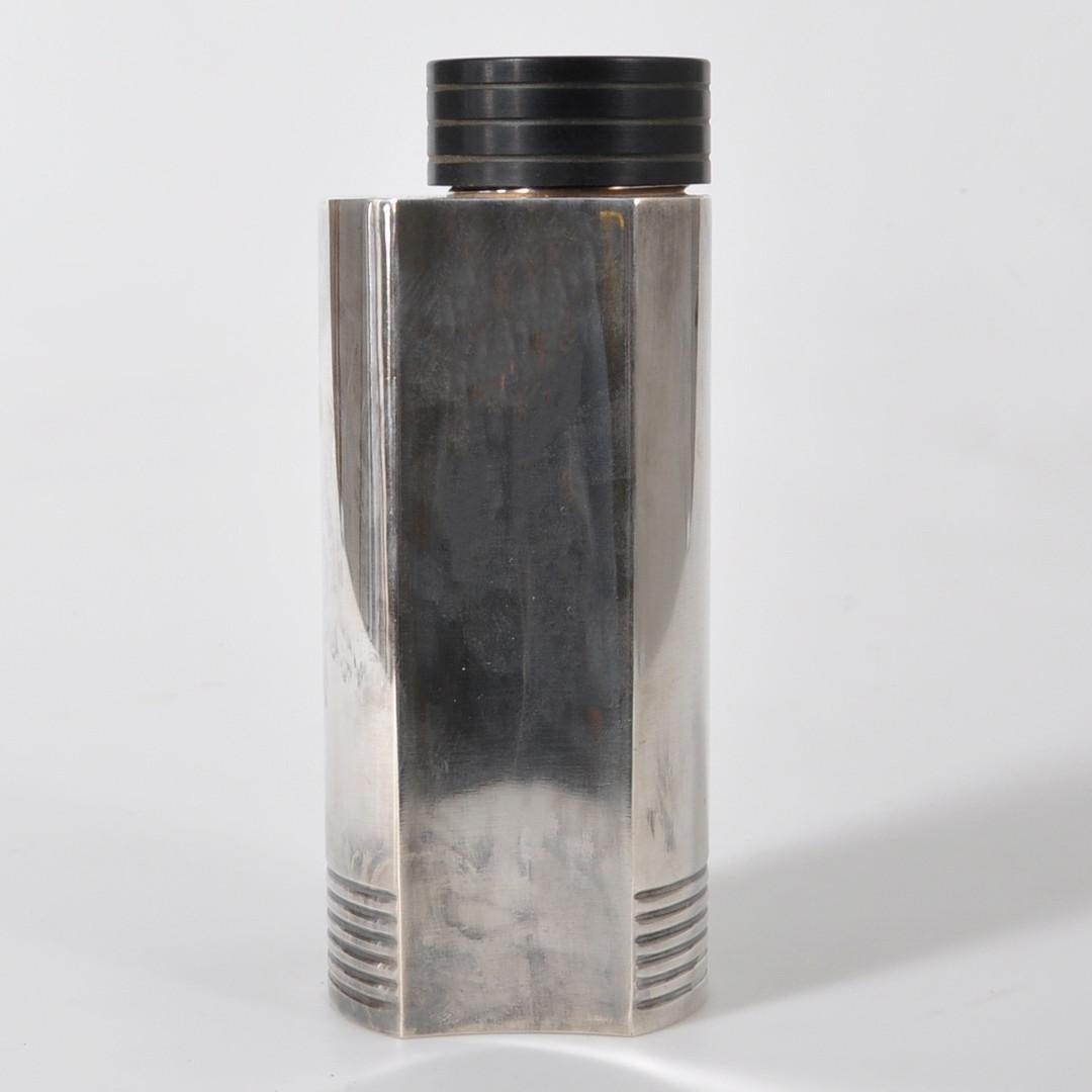 A fluted 1930s COCKTAIL SHAKER by Folke Arström, similar to the one that inspired the custom kitchen island designed by Jesse Parris-Lamb