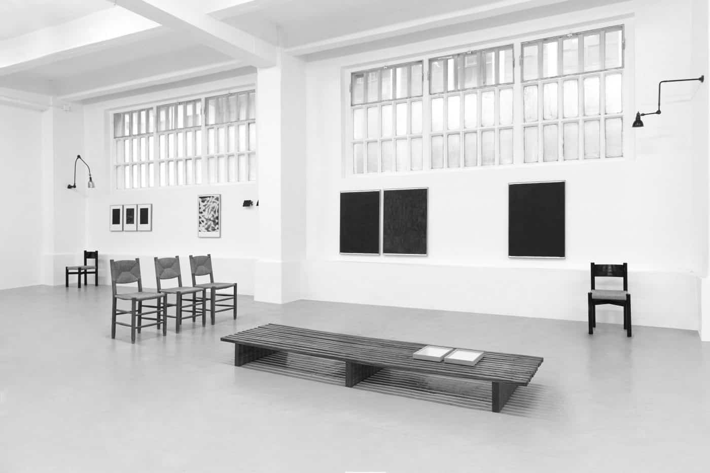 A black-and-white photo of DADA Studios' first exhibition, in October 2016.