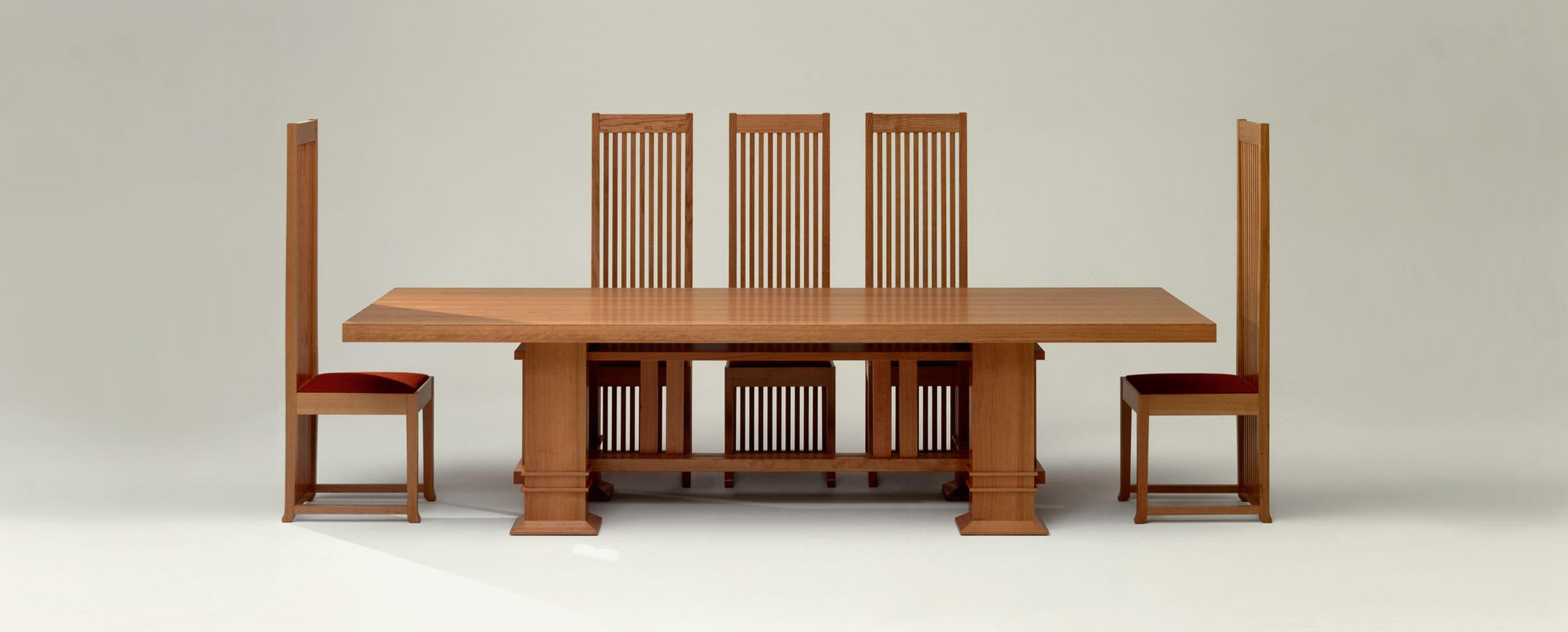 A dining table surrounded by FRANK LLOYD WRIGHT ROBIE CHAIRS, reissued by Cassina and offered by DADA Studios