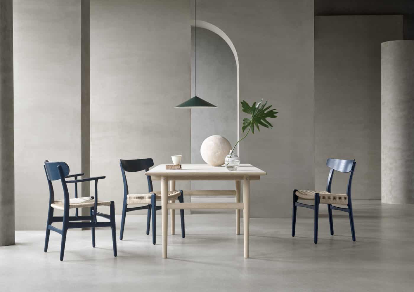 CH26 (far left) and CH23 dining chairs in North Sea blue by Hans J. Wegner and Ilse Crawford