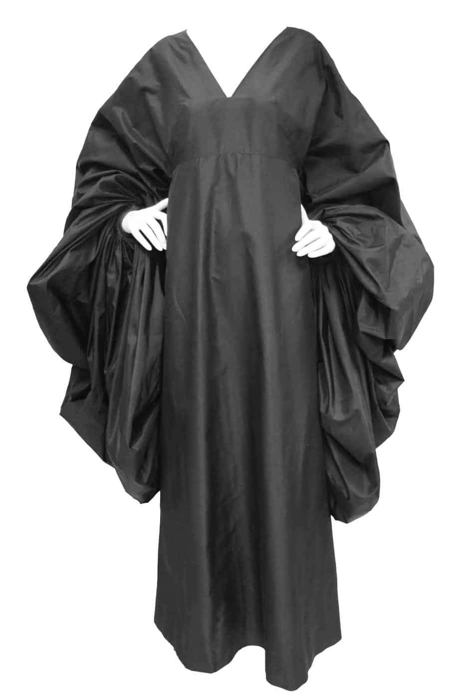 a black silk Madame Grès dress with voluminous sleeves 