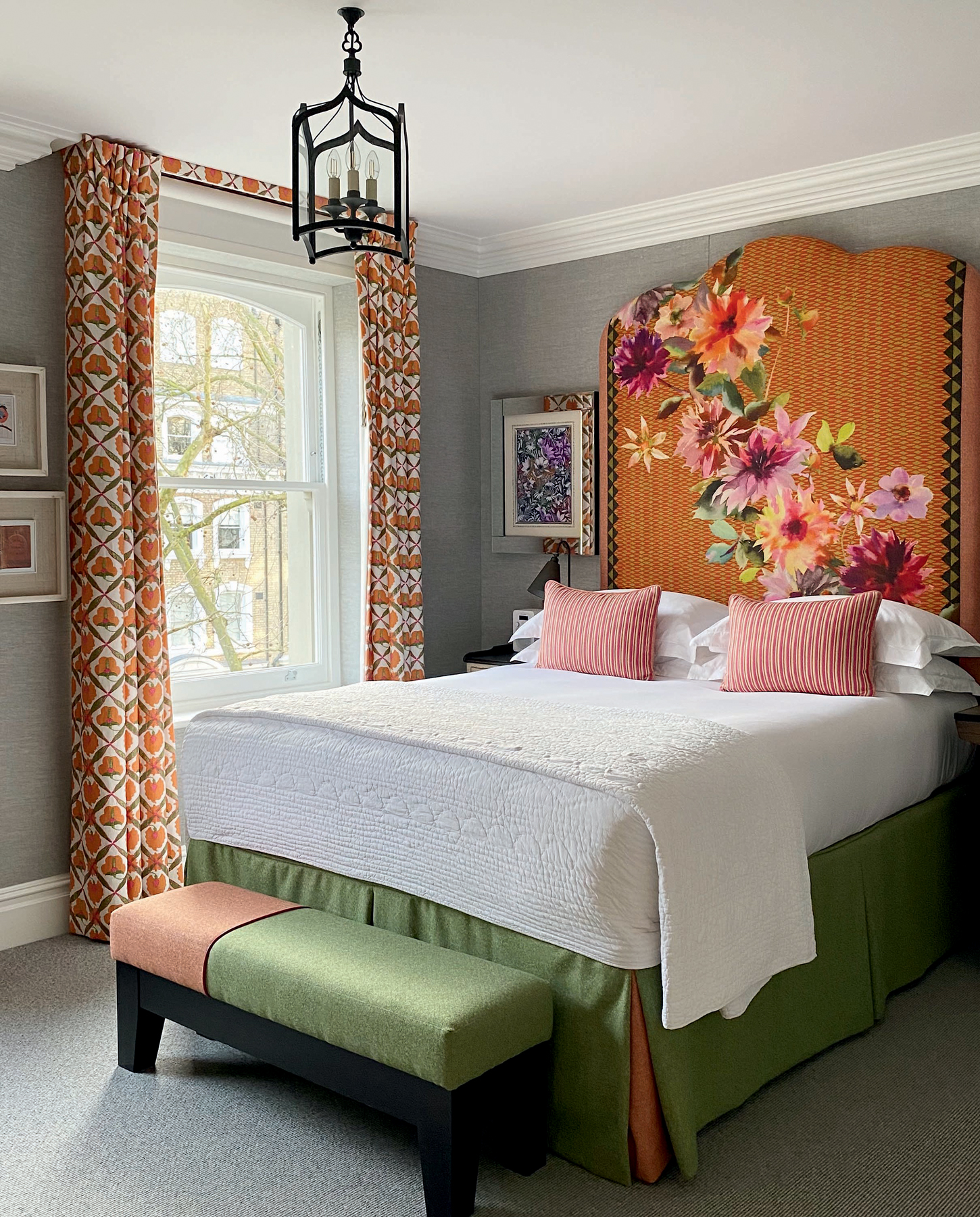 Bedroom with high floral printed headboard