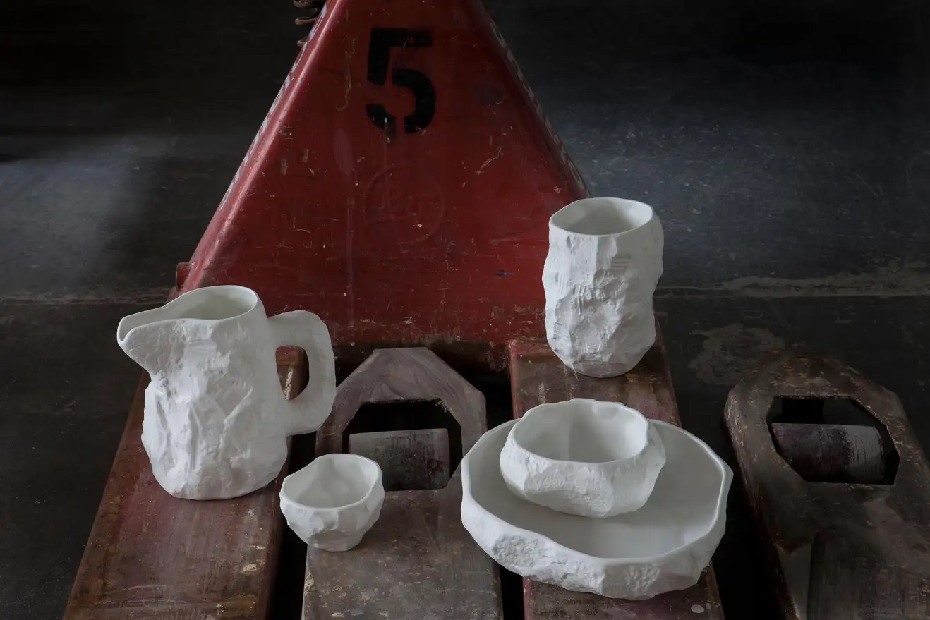 Bone China tableware made by artist Max Lamb from hand-carved plaster molds