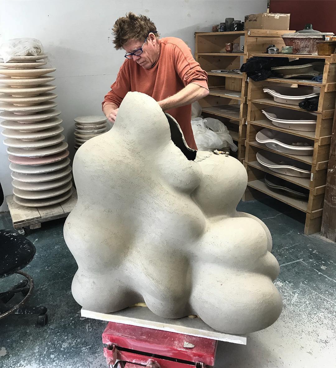 Chris Gustin works on a large-scale piece for his Cloud series ca. 2019