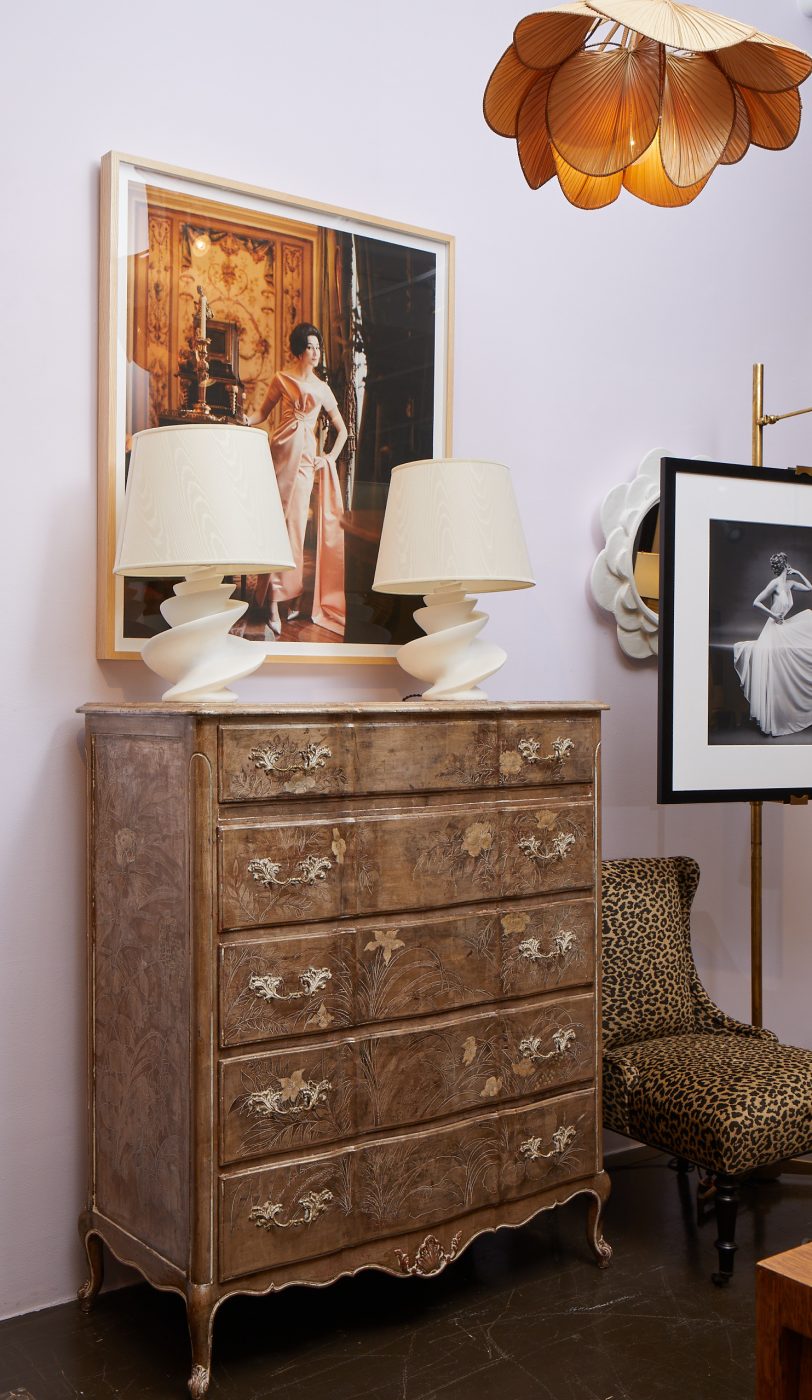 Dresser with matching lamps and framed artwork