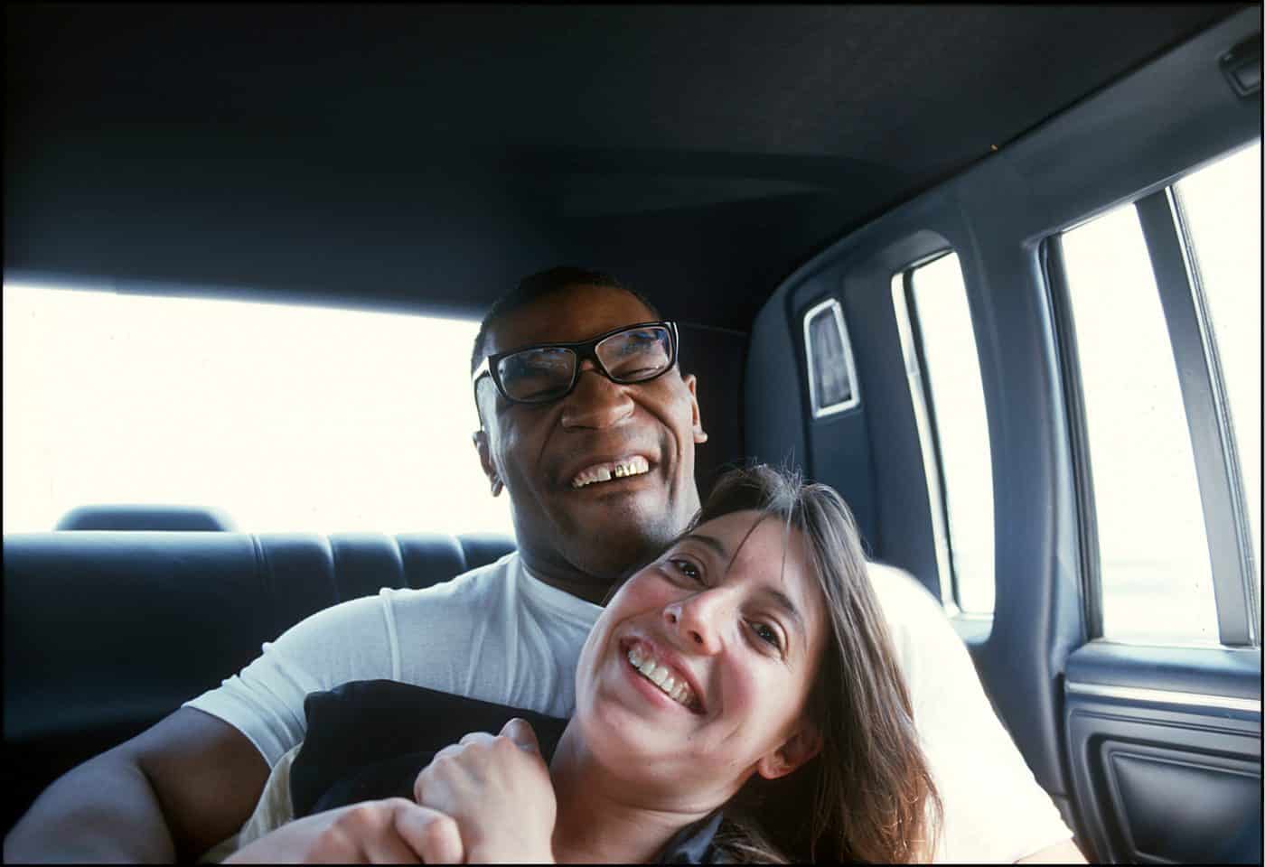 Mike Tyson in a limo with photographer Lori Grinker, Atlantic City, New Jersey, June 1988