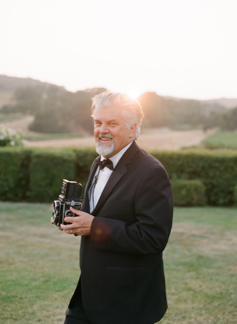 John Dolan holding a camera