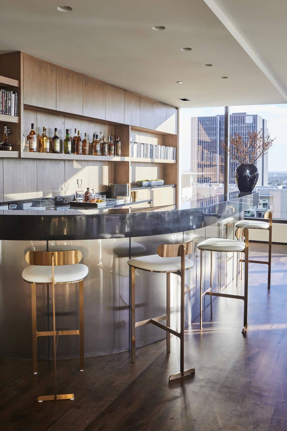 A cantilevered black marble bar in an L.A. Penthouse designed by Smith