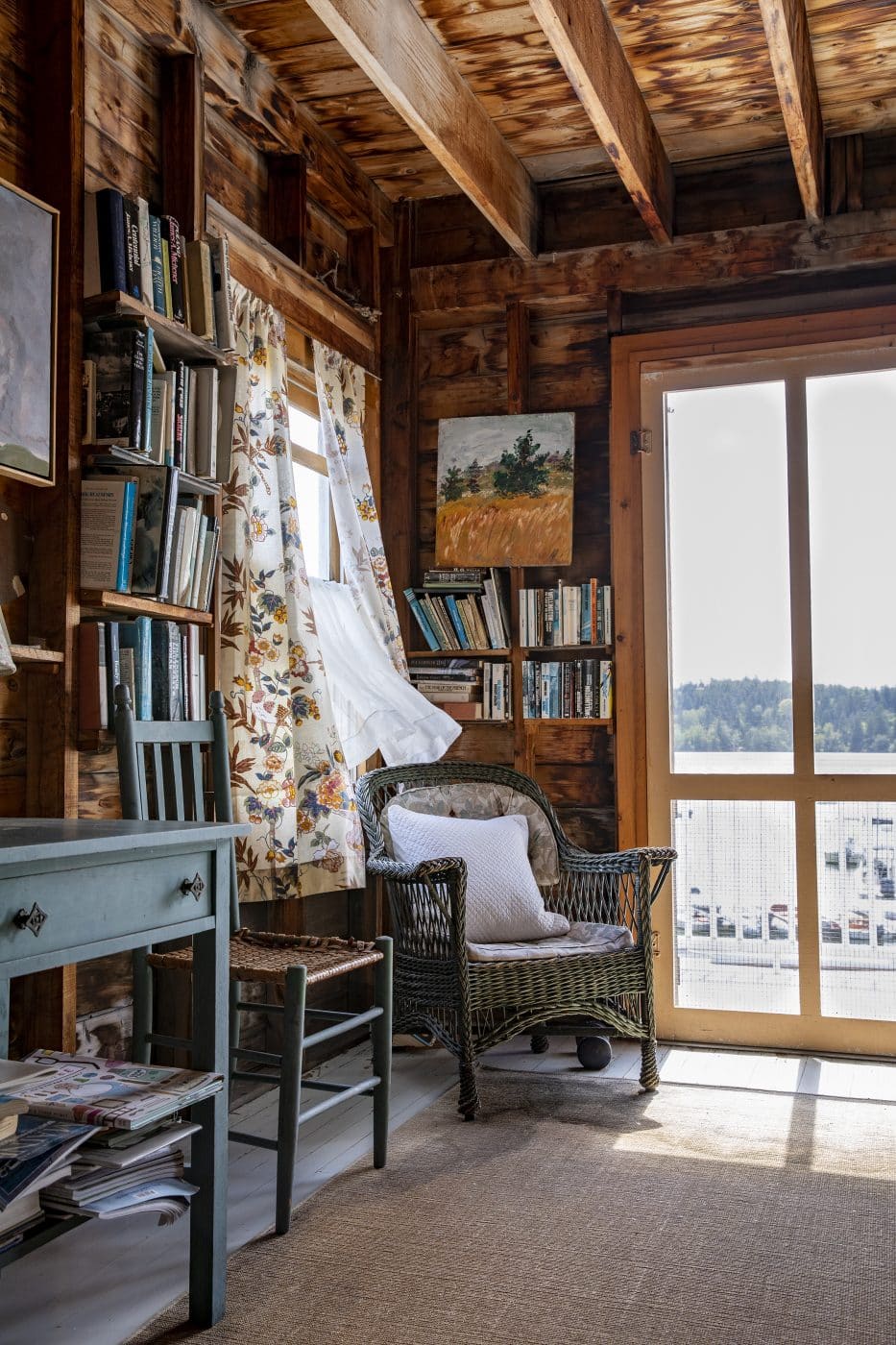 Wicker chair in the corner of a home in Maine