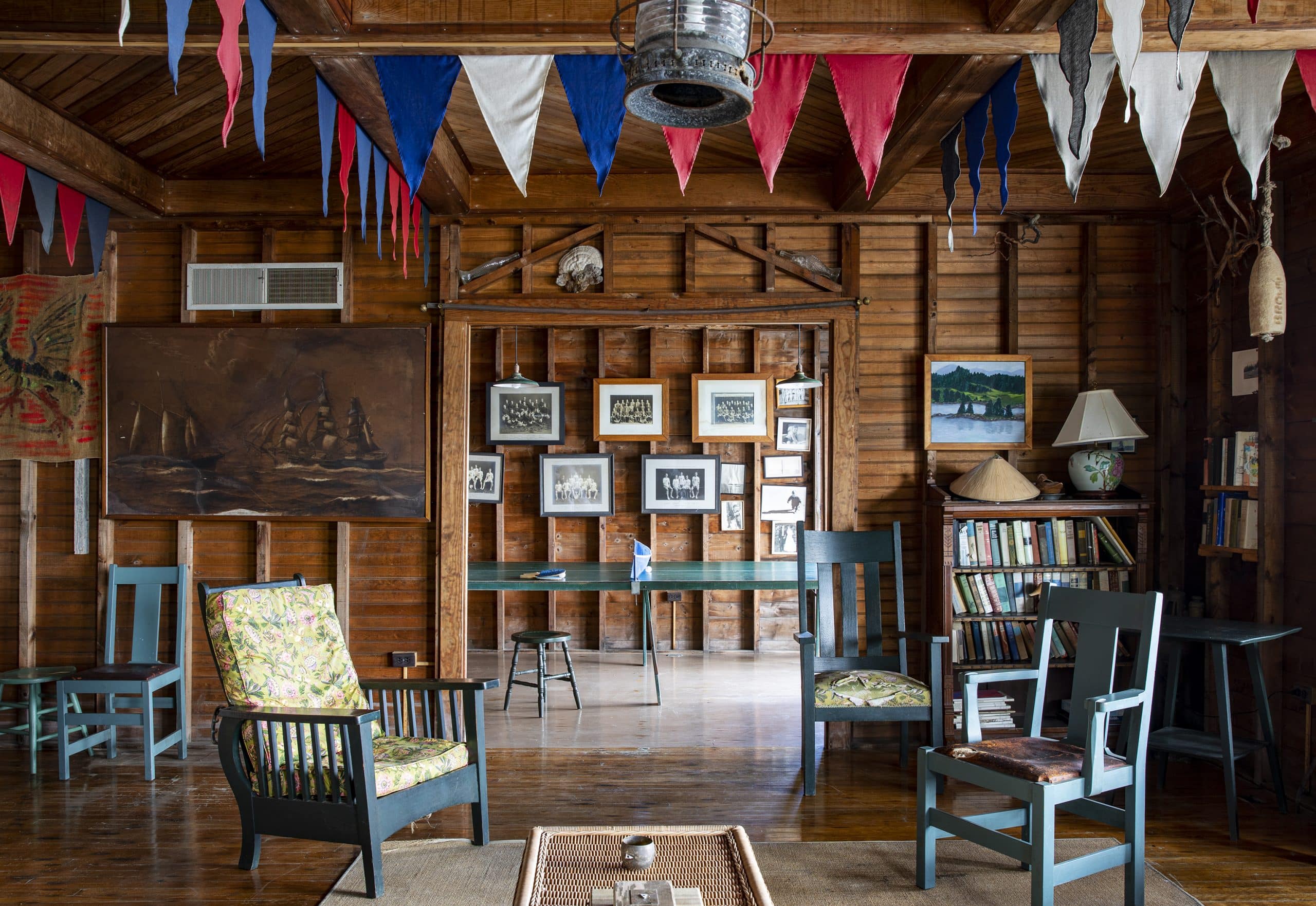 Wooden room in a Maine house featuring painted furniture