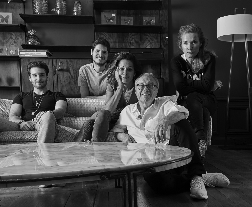 Serge Glustin (second from right) poses for a family photo with his daughters, Virginie (center) and Karine (far right), and grandchildren Ilan (far left) and Ruben (second from left), all of whom have followed in his footsteps to become furniture dealers. 