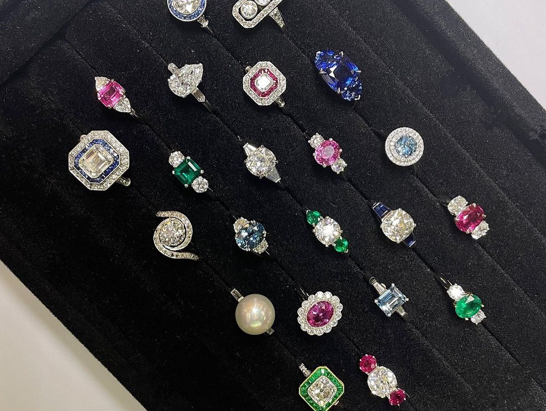 An array of diamond, pearl and colored-gemstone rings. 