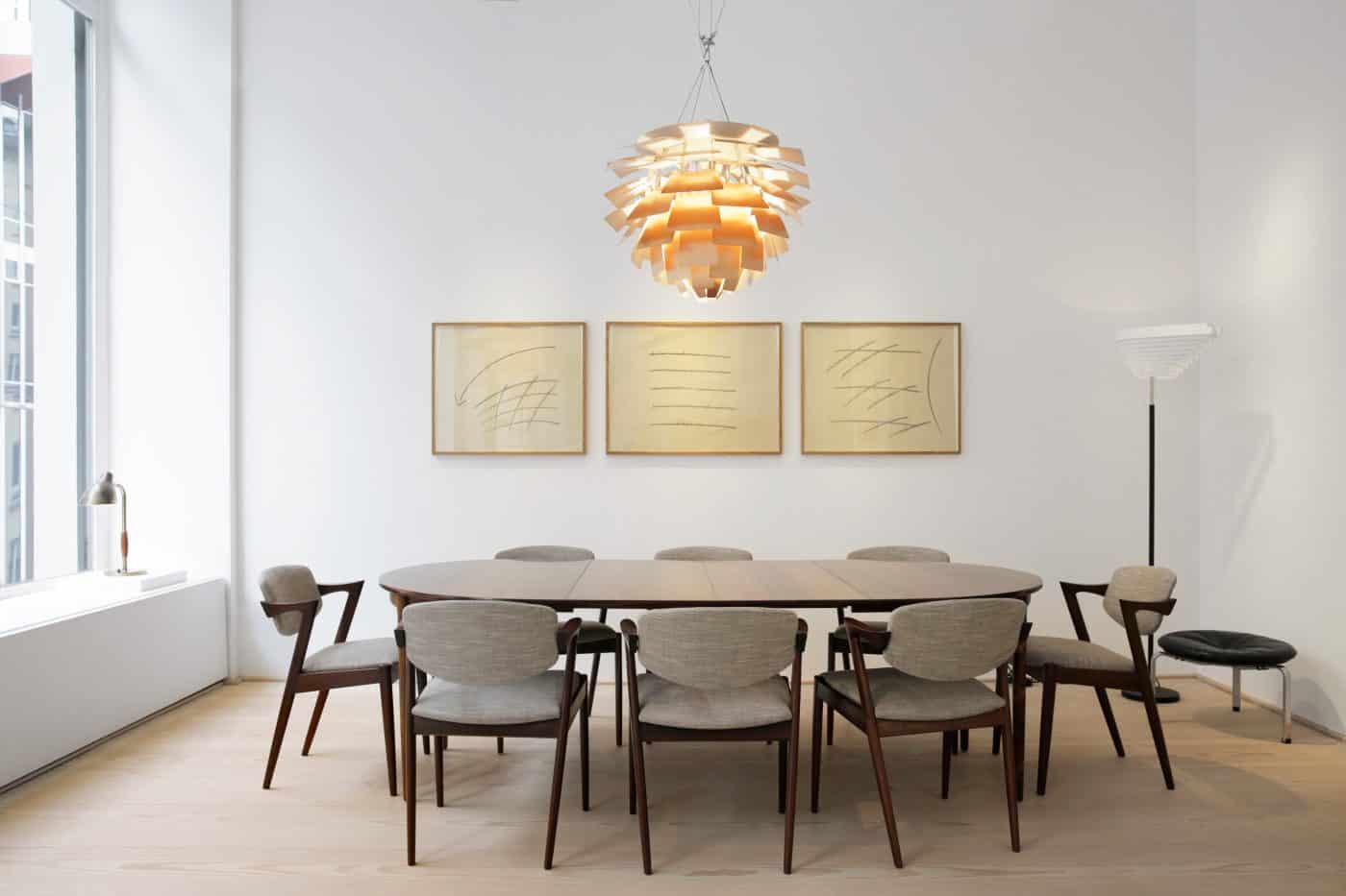 A VILHELM LAURITZEN TABLE LAMP,  POUL HENNINGSEN ARTICHOKE LAMP and ALVAR AALTO ANGEL WING FLOOR LAMP with an IB KOFOD-LARSEN dining table, KAI KRISTIANSEN chairs, trio of ANTON STANKOWSKI drawings and POUL KJÆRHOLM STOOL