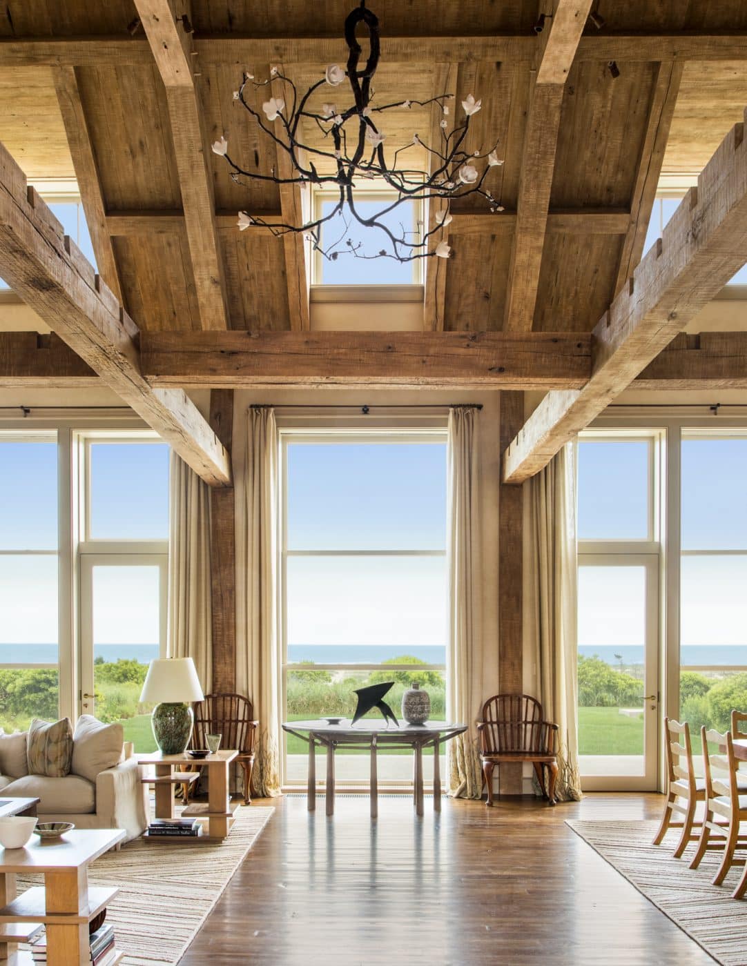 The great room of the home, featuring ocean views and a chevron-patterned rug