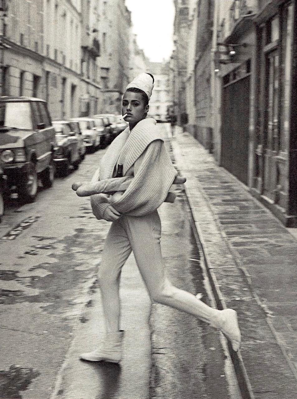 Yasmin Le Bon wore an AZZEDINE ALAÏA IVORY WOOL CARDIGAN from the Fall/Winter 1984–85 collection in the New York Times Magazine's "Paris Panache" editorial shot by Peter Lindbergh in Paris in 1985.
