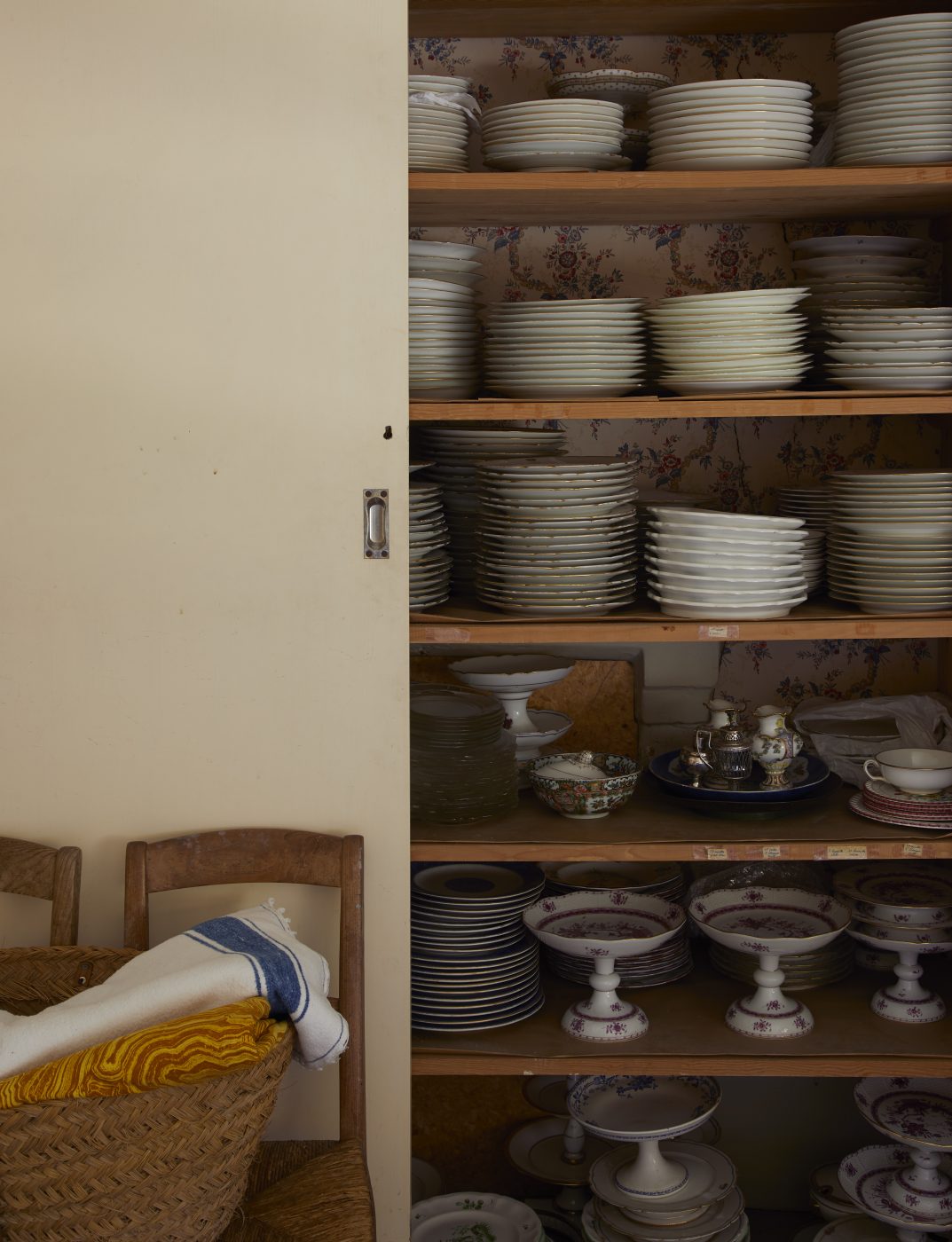 A cabinet with dinnerware
