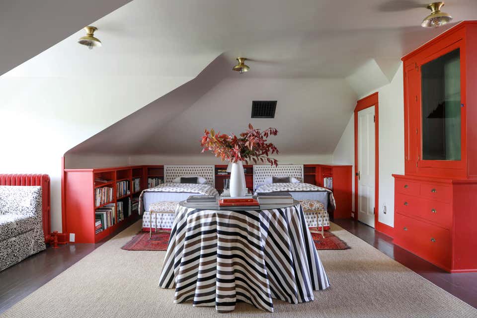 White bedroom with red millwork by Emily Tucker