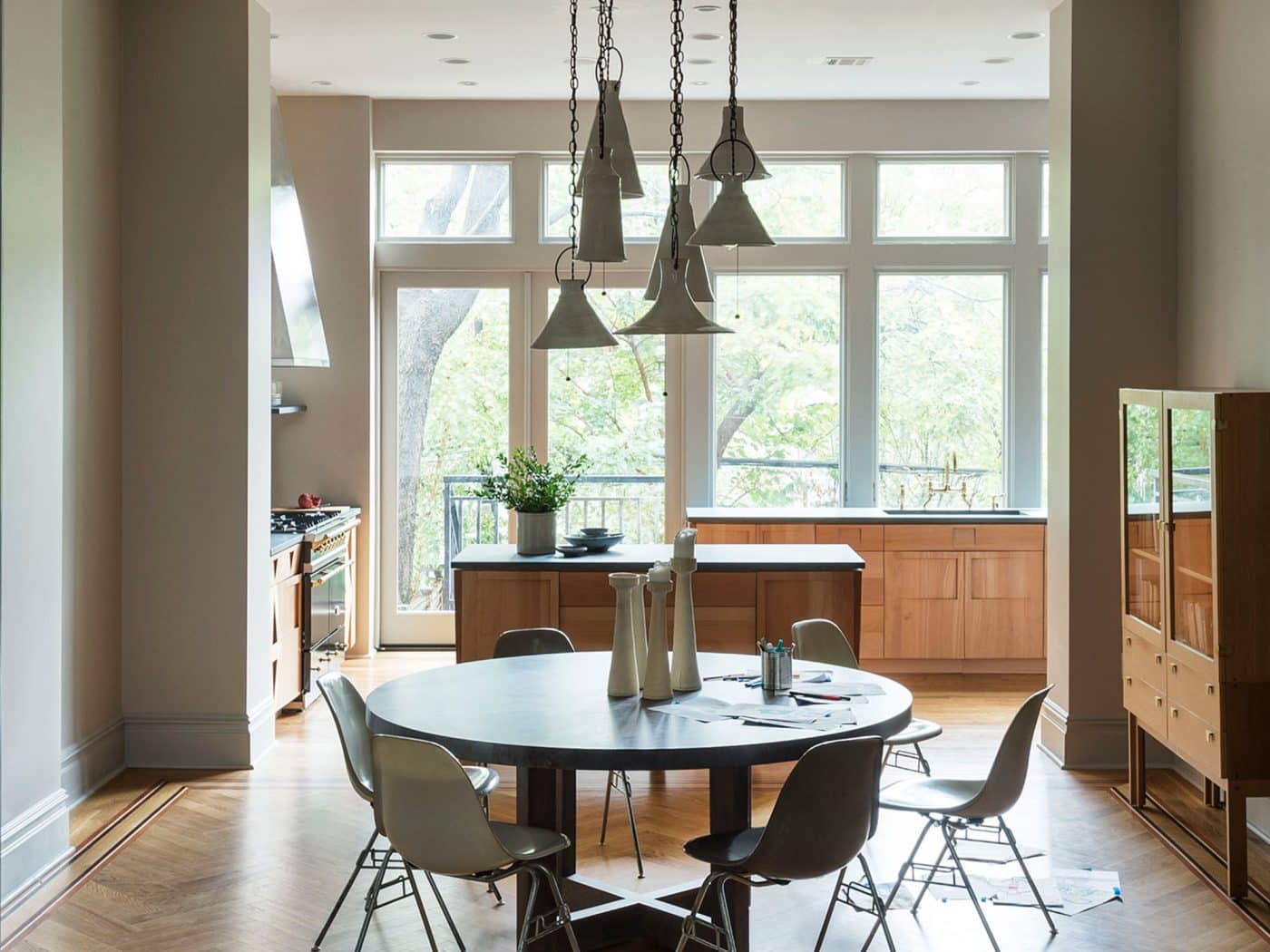 Dining area with view into windowed kitchen of Boerum Hill Brooklyn townhouse home designed by Workstead