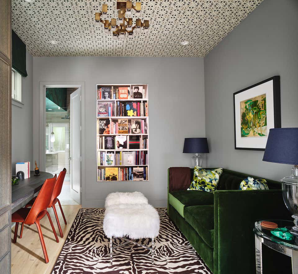 Colorful office with green couch and zebra rug by Tineke Triggs