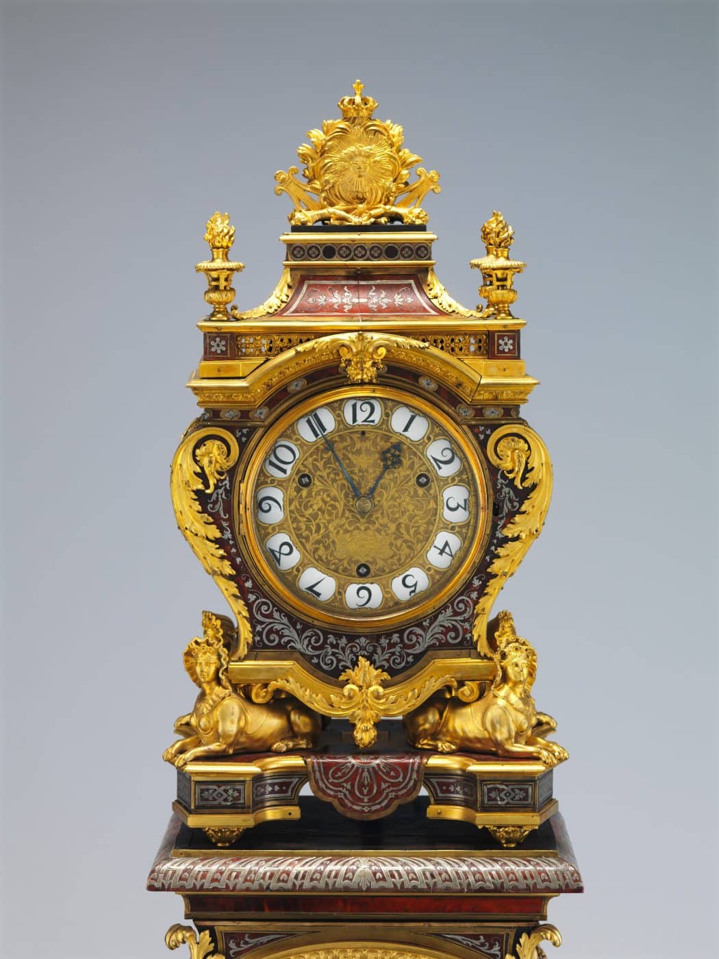 Clock with pedestal with a similar shape to the character "Cogsworth" from Beauty and the Beast