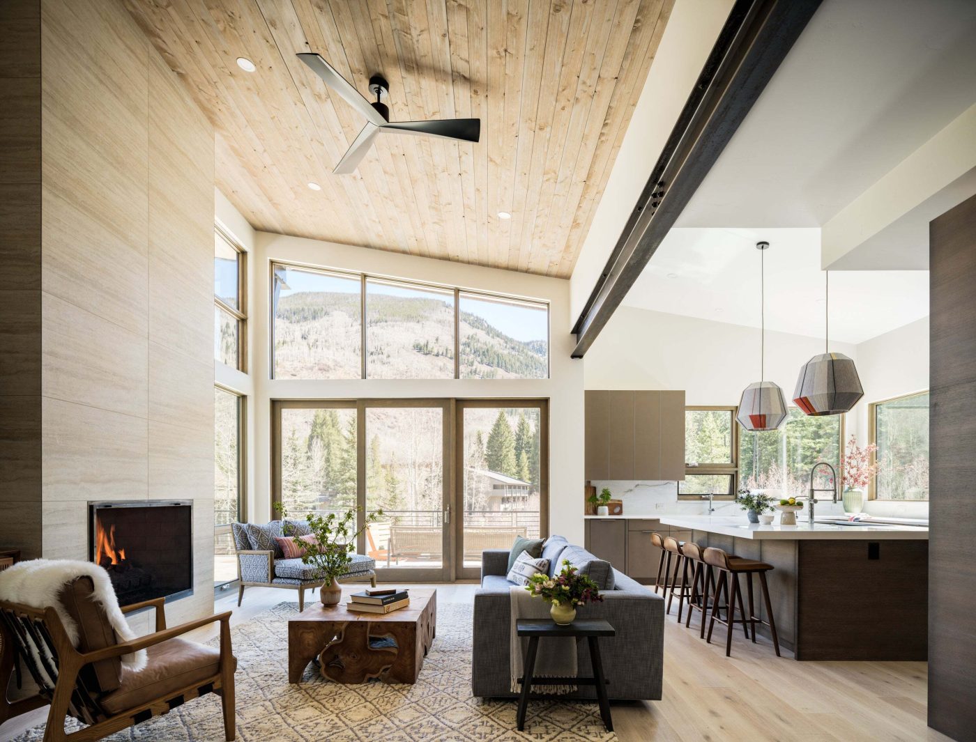 neutral toned living room and kitchen in Vail by Emily Tucker