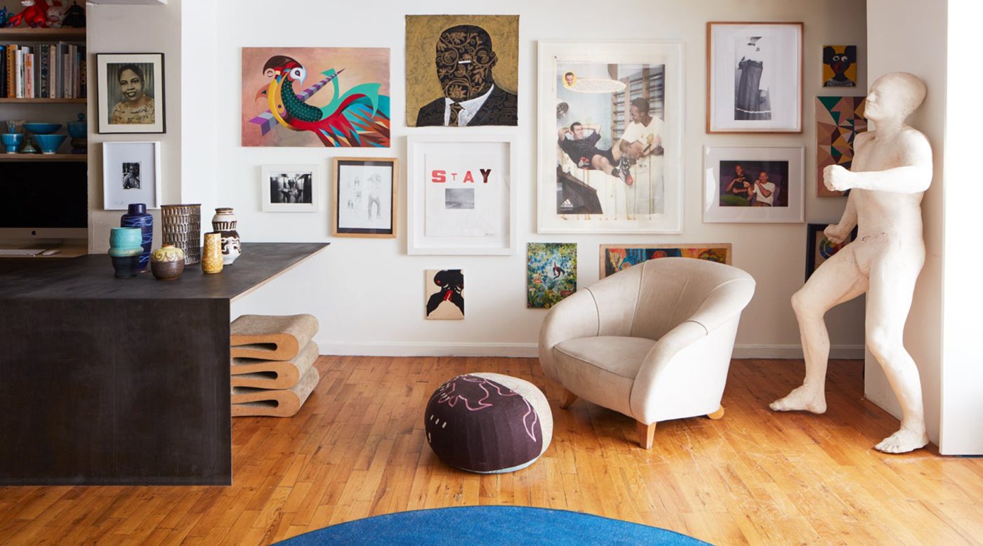 Lewis's Brooklyn loft features a gallery wall with many art pieces