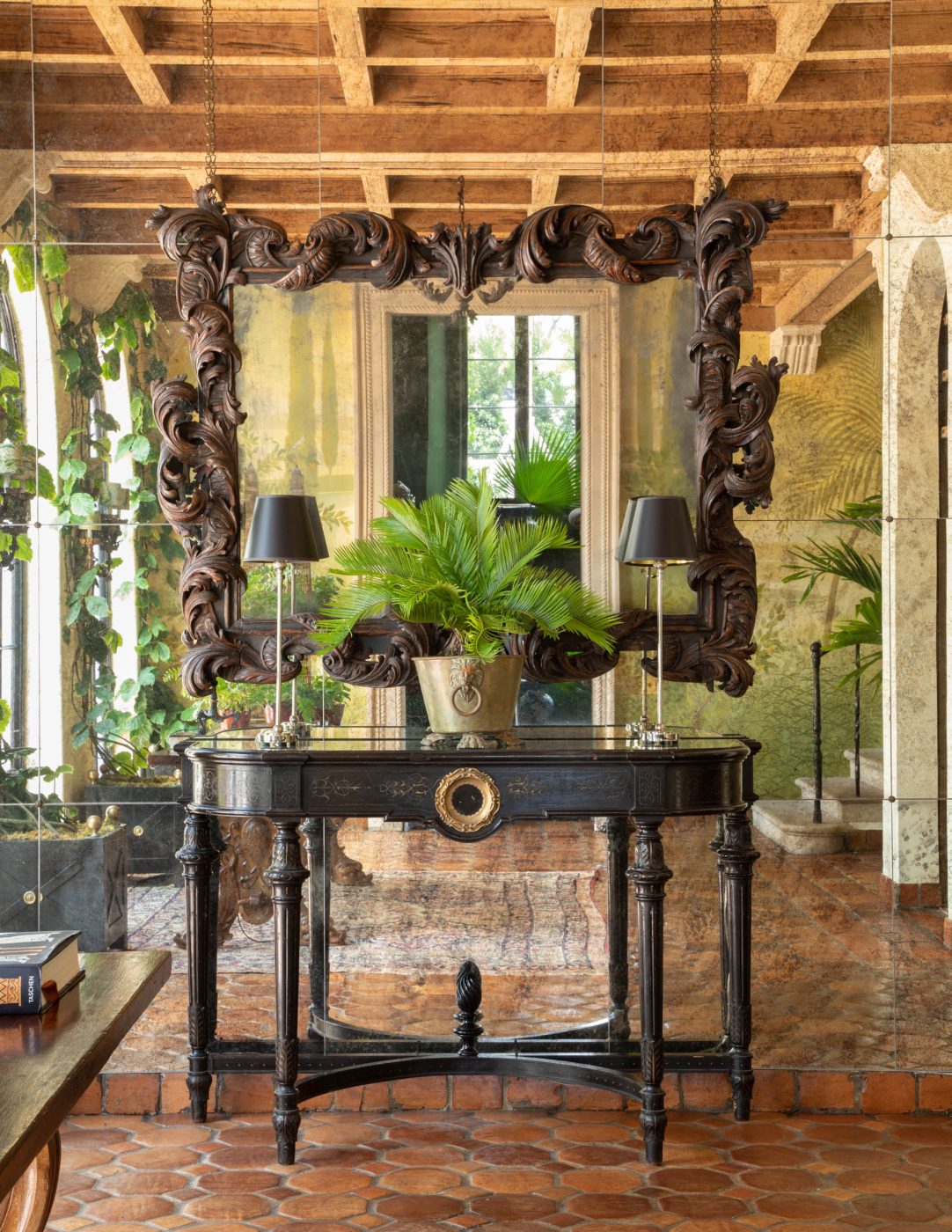 An antique-mirrored wall in the stair hall