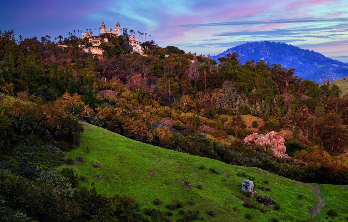 A view of Hearst Castle atop a hill