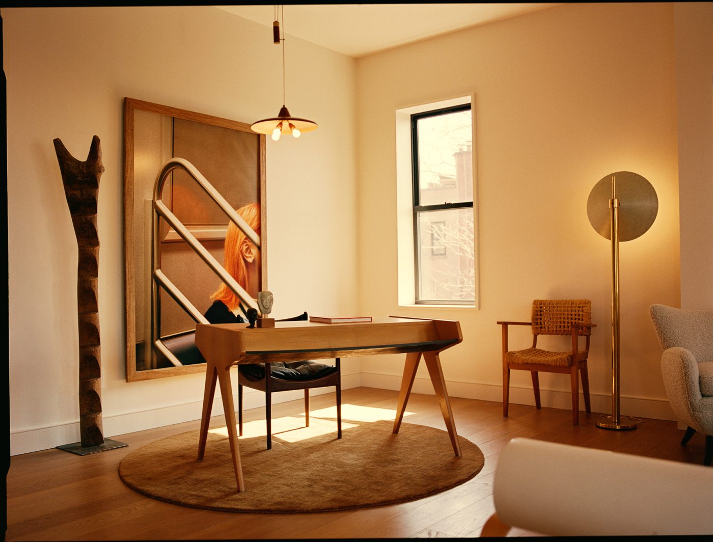 The Brooklyn apartment, featuring Lunch Poem, by Clement Pascal, a desk, a Kristian Vedel Modus leather chair and a rope chair by Adrien Audoux and Frida Minet