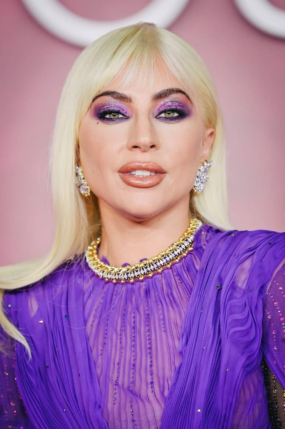 A photo of Lady Gaga wearing Jean Schlumberger for Tiffany & Co. at the UK premier of House of Gucci
